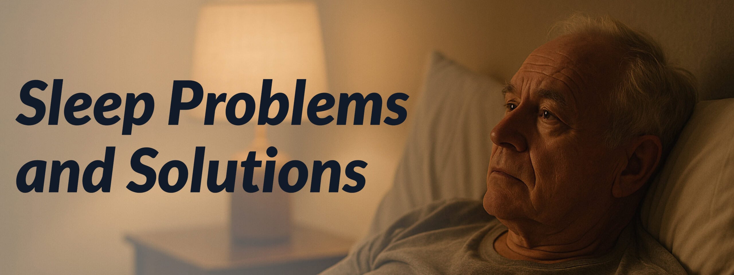 Older man lying awake in bed at night, looking thoughtful, with warm bedside lamp light — representing sleep problems and solutions for older adults.